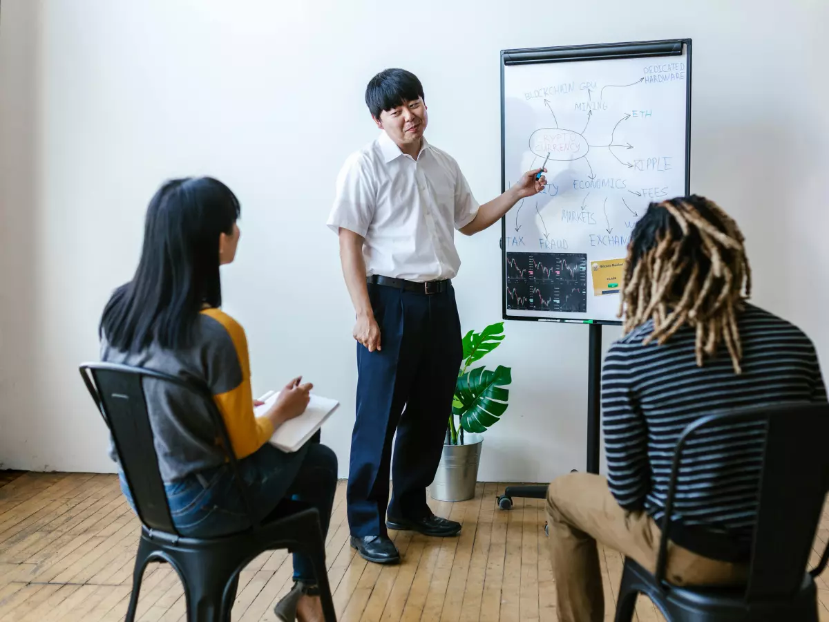 A speaker presenting to an audience in a casual setting.